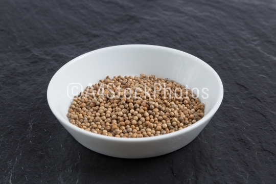 Coriander in a bowl on a slate