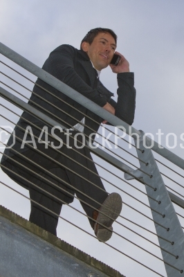 Man leaning against railing