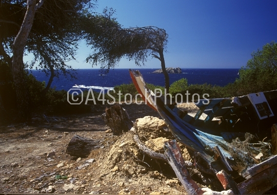 A wrecked boat in Ibiza