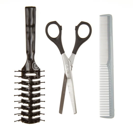 Cutting scissors or shears and black comb and a black brush