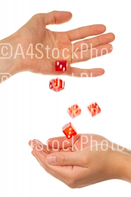 Five red dice being thrown from a hand