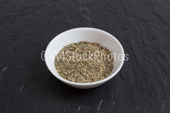 Provencal herbs in a bowl on a slate