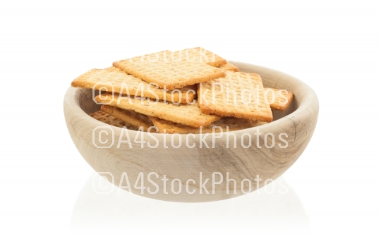 Simple crackers in a wooden bowl