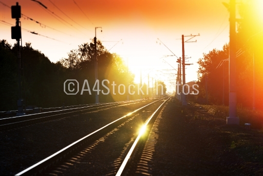 Sunset railway with light leak  landscape background