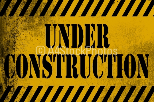 Under construction sign yellow with stripes