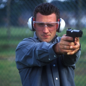 A man practising his shooting skills on the firing range