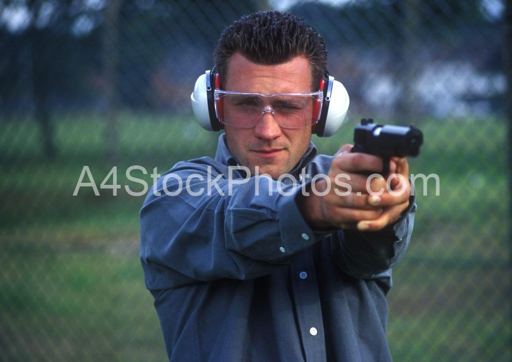 A man practising his shooting skills on the firing range