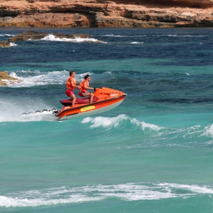 Two lifeguards on a speedboat at a mediterranean holiday resort