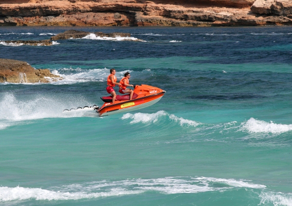 Two lifeguards on a speedboat at a mediterranean holiday resort