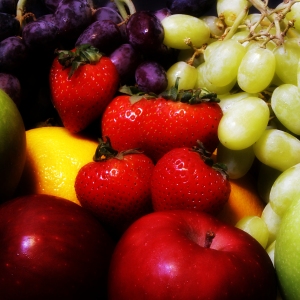 A selection of healthy fruit against a dark background