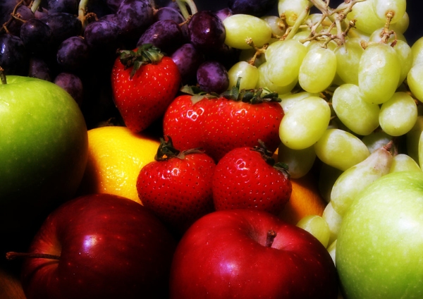 A selection of healthy fruit against a dark background