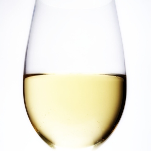 A close up view of a glass of white wine