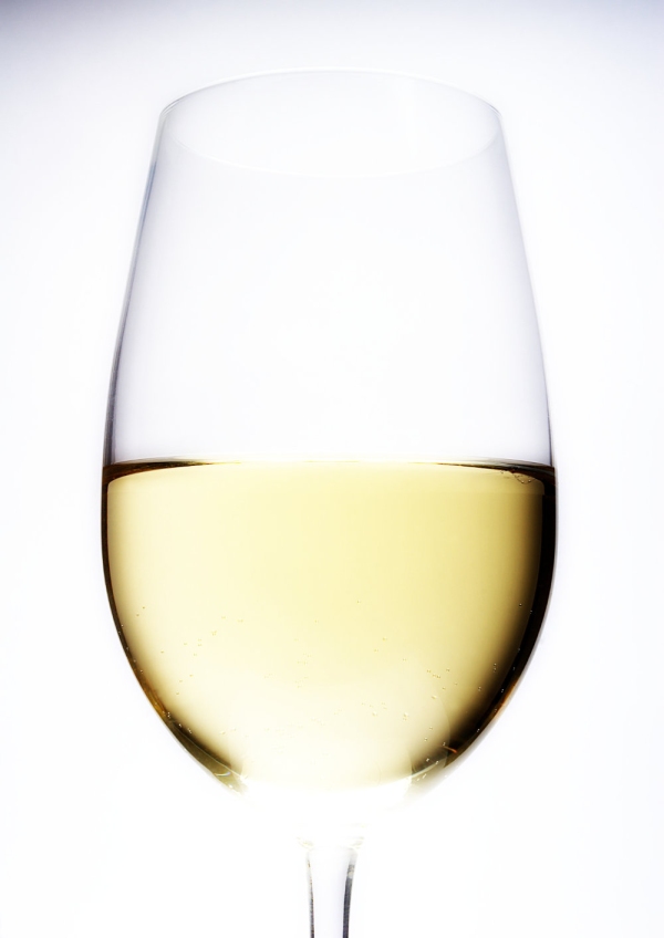 A close up view of a glass of white wine