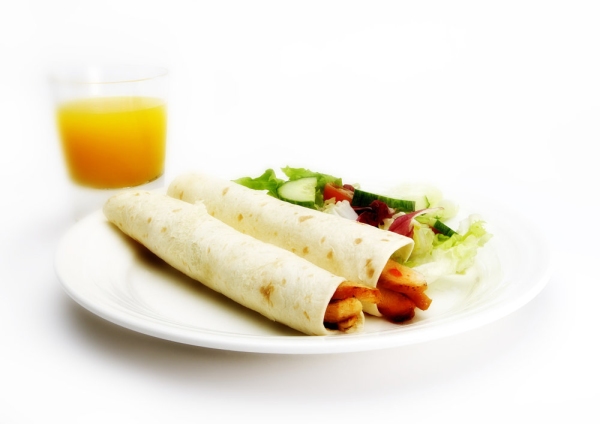 chicken wraps with a green salad and fresh orange juice