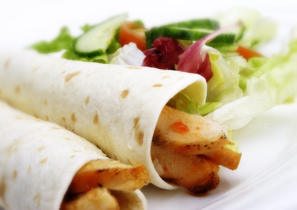 chicken wraps, pancake, salad, lettuce, cucumber, tomato, orange juice, salad, vegetables