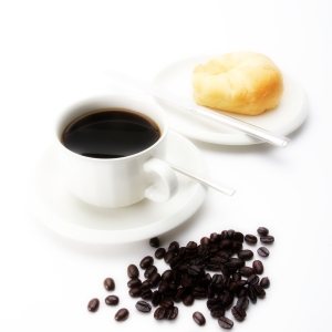 A cup of coffee with doughnut