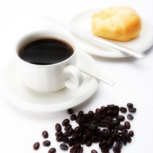 A cup of coffee with doughnut