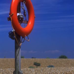 A lifebelt station on a shingle beach close to the sea