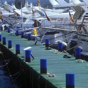 A jetty at the marina, with luxury yachts at anchor