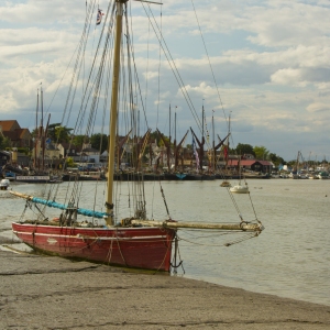 A sailing boat sitting on the mud at Maldon in Essex at low tide