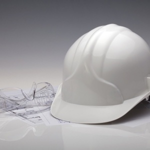 Photo of an industrial hard hat and protective glasses