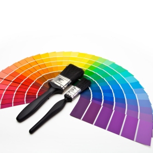 Paintbrushes and colour swatches arranged in a fan