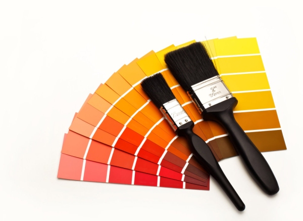 Fan of colour swatches with two paintbrushes