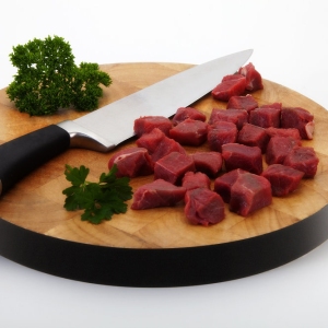 steak and knife on a chopping board.