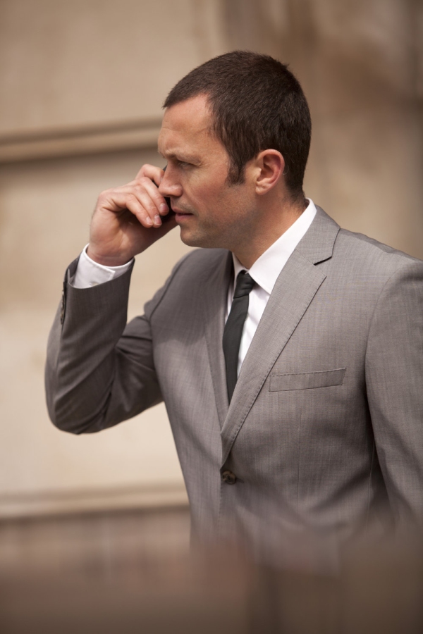 A close protection security officer on the radio to HQ or colleagues