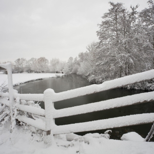 Snowy landscape on the River Stour at Flatford Mill in Suffolk