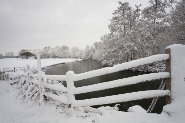 Snowy landscape on the River Stour at Flatford Mill in Suffolk