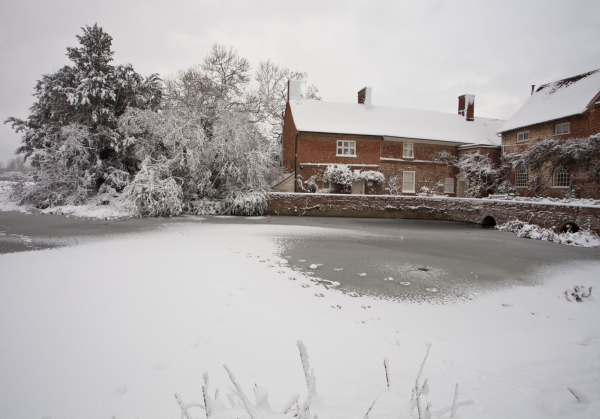 Flatford Mill on the River Stour after a heavy snowfall