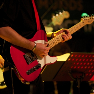 Close up of guitar player in a rock band