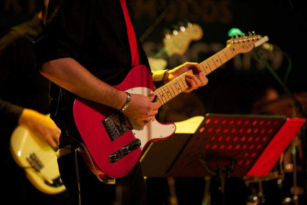 Close up of guitar player in a rock band