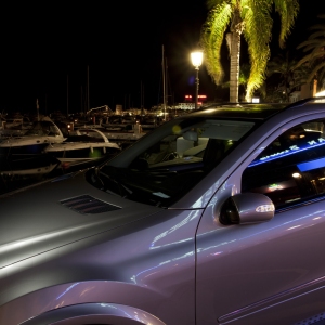 Luxury cars and yachts at the marina in Puerto Banuz, Southern Spain