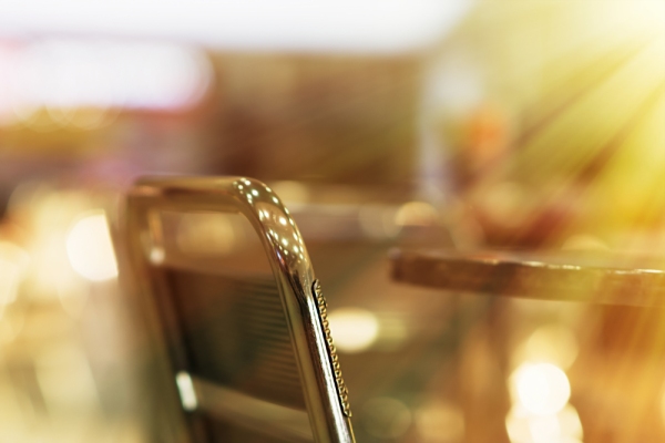 A cafe chair in a blurred cafe background