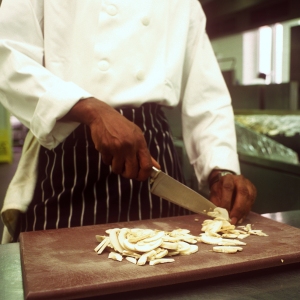 chef, cook, sous chef, chopping board, knife, carving knife, mushrooms, kitchen, restaurant, cafe, catering