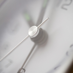 A close up view of a grey clock face