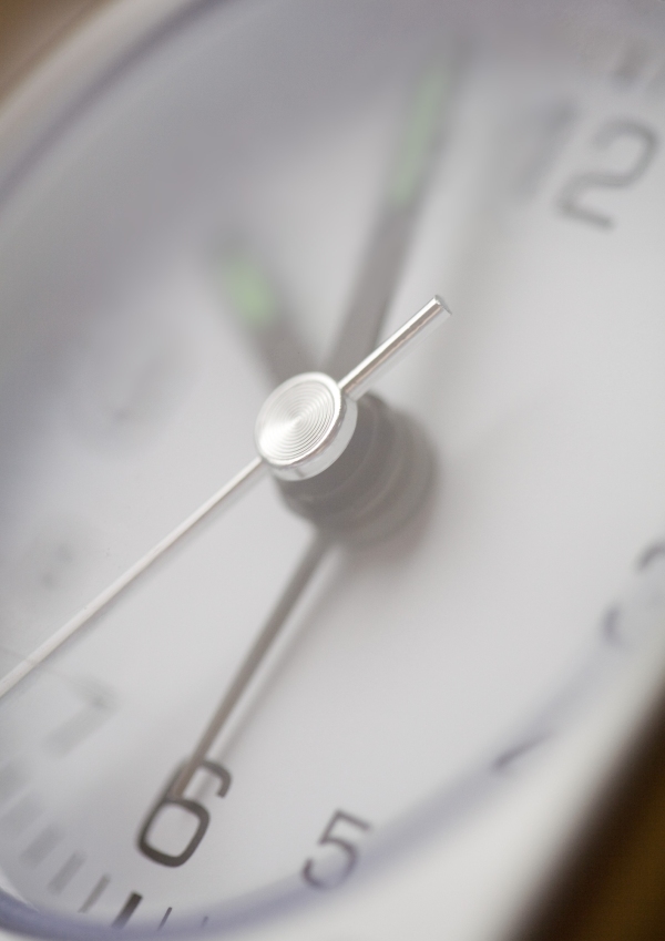 A close up view of a grey clock face