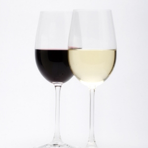 Two wine glasses, one red, one white