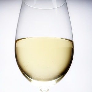 An artistic view of a glass of white wine