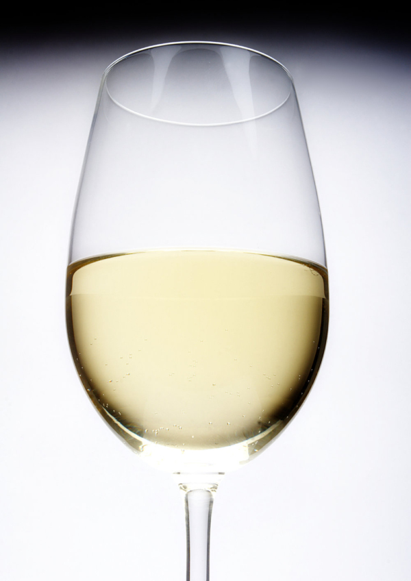 An artistic view of a glass of white wine