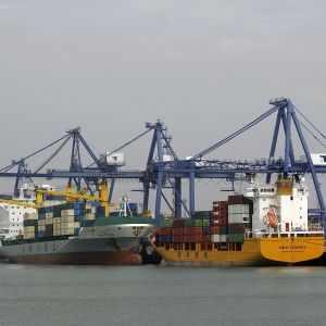 Container ships docked at the port ready for unloading