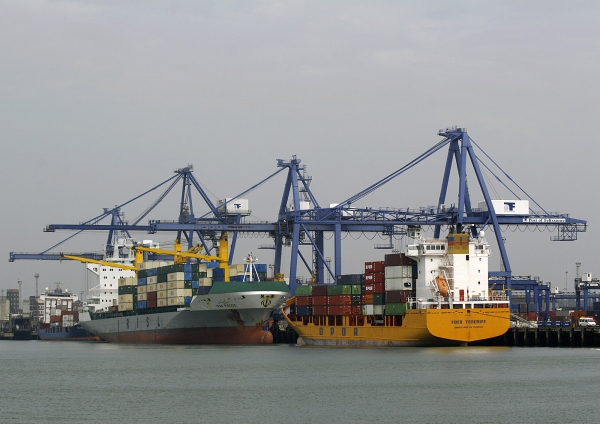 Container ships docked at the port ready for unloading