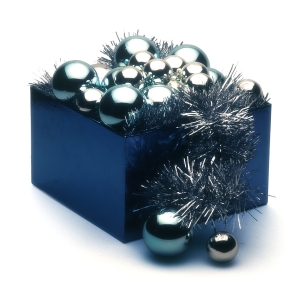 A blue box of silver Christmas baubles