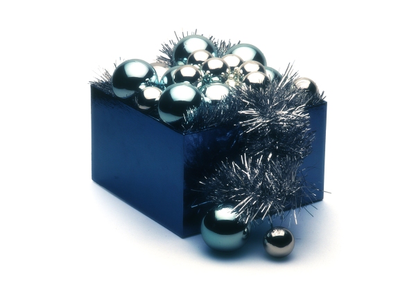 A blue box of silver Christmas baubles