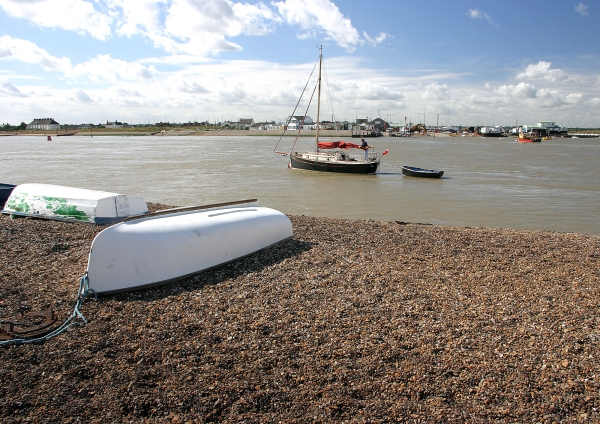 Upturned boats on the shingle beach at Bawdesey in Suffolk