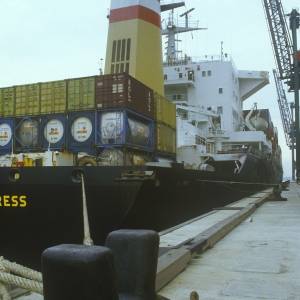 Wide angle view of a container ship moored to the quayside awaiting unloading