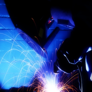 An electric grinder or spot welder working in a dark environment