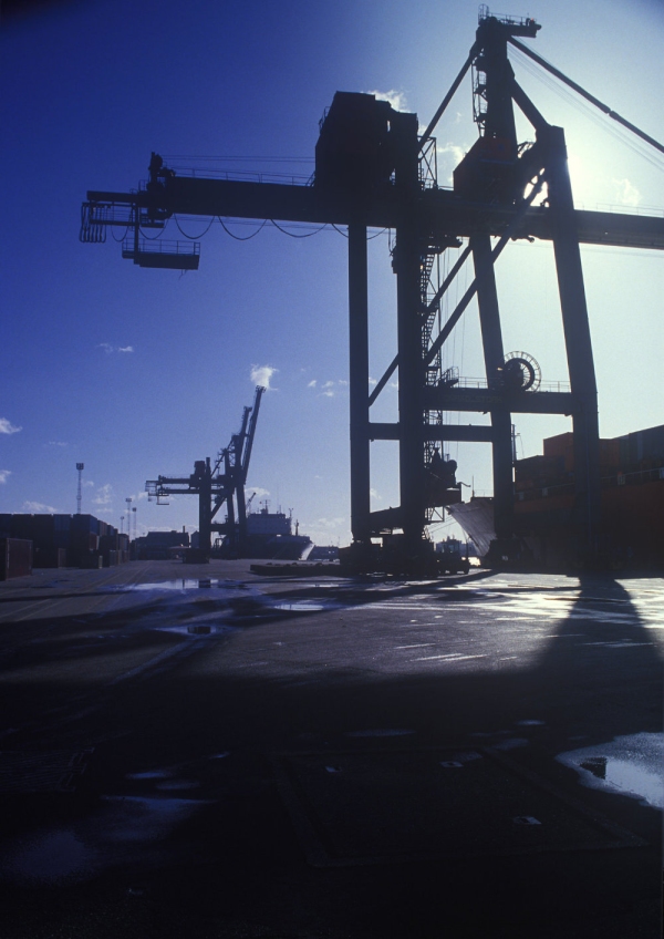 Sun silhouettes at the container port